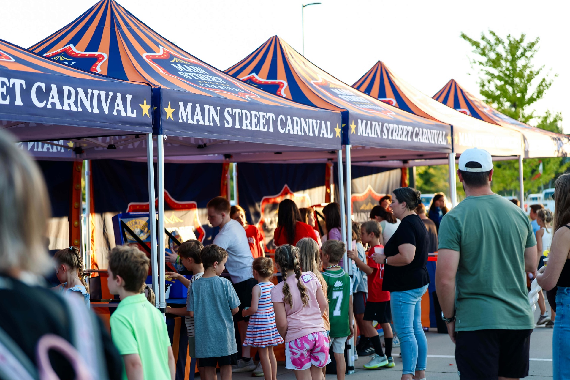 Main Street Carnival tents with guests